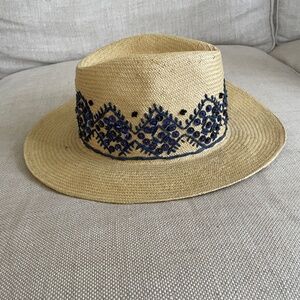 Tory Burch straw sun hat embellished with navy blue stitching and sequins